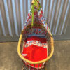 Rotan poppenwiegje met Stenzo kabouterstof. Verkocht.
